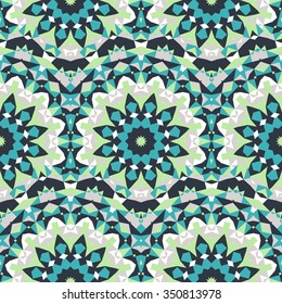 Vector ethnic colorful bohemian pattern in green colors with abstract flowers. Geometric background with Scandinavian, Nordic, Russian, Slavic motif. Bold print with stars, mandalas, triangle, polygon