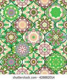 Vector ethnic colorful bohemian pattern in green colors with big abstract flowers. Geometric background with Arabic, Indian, Moroccan, Aztec motifs. Ornate print with mandalas within clipping mask