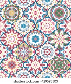 Vector ethnic colorful bohemian pattern in pastel colors with big abstract flowers. Geometric background with Arabic, Indian, Moroccan, Aztec motifs. Ornate print with mandalas within clipping mask