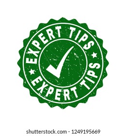 Vector Expert Tips grunge stamp seal with tick inside. Green Expert Tips imprint with grunge texture. Round rubber stamp imprint.