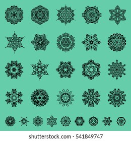 Vector falling snow set. Showflakes icon collection. Set of twenty nine snowflakes and dots on a green background. Starry Sky.