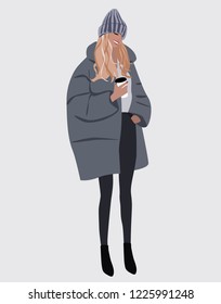 Vector fashion illustration of smiling trendy modern girl with cup of coffee in grey winter coat and grey hat. Fall winter trendy collection. Flat Graphic