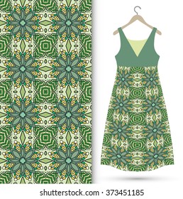 Vector fashion illustration. Women's dress on a hanger and seamless fabric pattern with repeating floral geometric texture. Hand drawn isolated elements for scrapbook, invitations or cards design.