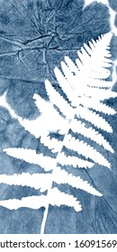 Vector fern leaves on abstract indigo tie dye background. Hand drawn plants  on blue decorative texture. Clipping mask is used for further easy editing.