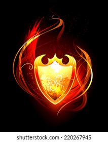 Vector fiery shield on black background.