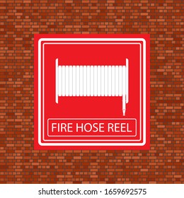 Vector Fire Hose Reel Icon on Orange Brick Wall.