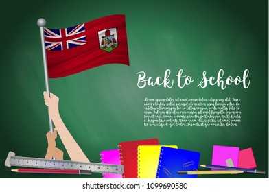 Vector flag of Bermuda on Black chalkboard background. Education Background with Hands Holding Up of Bermuda flag. Back to school with pencils, books, school items learning and childhood concept.