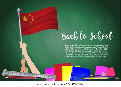Vector flag of China on Black chalkboard background. Education Background with Hands Holding Up of China flag. Back to school with pencils, books, school items learning and childhood concept.