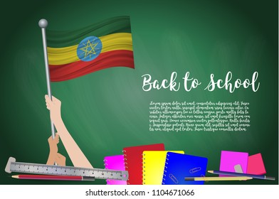 Vector flag of Ethiopia on Black chalkboard background. Education Background with Hands Holding Up of Ethiopia flag. Back to school with pencils, books, school items learning and childhood concept.