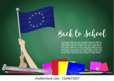 Vector flag of European Union on Black chalkboard background. Education Background with Hands Holding Up of European Union flag. Back to school with pencils, books, school items learning and childhood