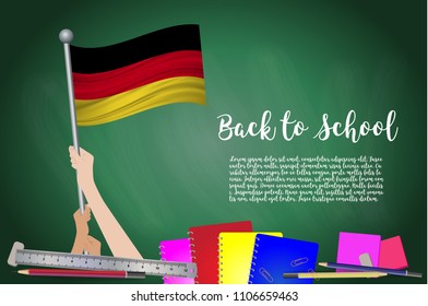 Vector flag of Germany on Black chalkboard background. Education Background with Hands Holding Up of Germany flag. Back to school with pencils, books, school items learning and childhood concept.