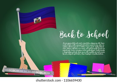 Vector flag of Haiti on Black chalkboard background. Education Background with Hands Holding Up of Haiti flag. Back to school with pencils, books, school items learning and childhood concept.