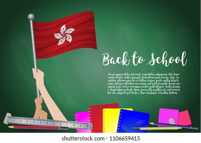 Vector flag of Hong Kong on Black chalkboard background. Education Background with Hands Holding Up of Hong Kong flag. Back to school with pencils, books, school items learning and childhood concept.