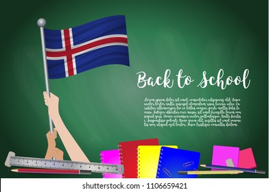 Vector flag of iceland on Black chalkboard background. Education Background with Hands Holding Up of iceland flag. Back to school with pencils, books, school items learning and childhood concept.
