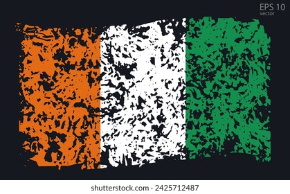 Vector flag of Ivory Coast. Vector illustration with cracks and abrasions.