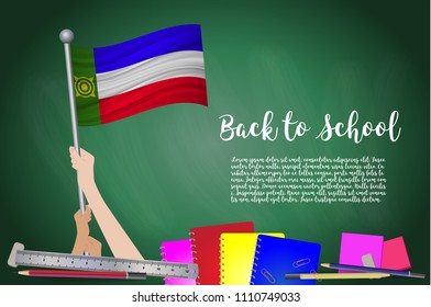 Vector flag of Khakassia on Black chalkboard background. Education Background with Hands Holding Up of Khakassia flag. Back to school with pencils, books, school items learning and childhood concept.