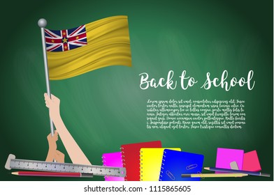 Vector flag of Niue on Black chalkboard background. Education Background with Hands Holding Up of Niue flag. Back to school with pencils, books, school items learning and childhood concept.