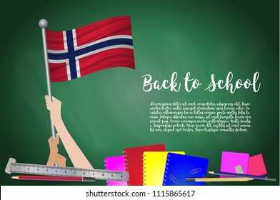 Vector flag of Norway on Black chalkboard background. Education Background with Hands Holding Up of Norway flag. Back to school with pencils, books, school items learning and childhood concept.
