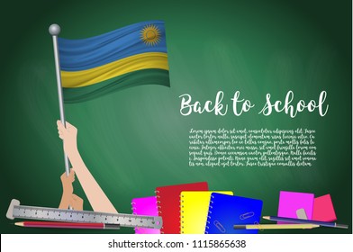Vector flag of Rwanda on Black chalkboard background. Education Background with Hands Holding Up of Rwanda flag. Back to school with pencils, books, school items learning and childhood concept.