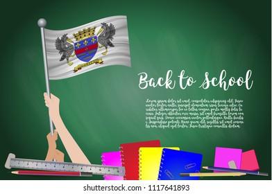Vector flag of Saint Barthelemy on Black chalkboard background. Education Background with Hands Holding Up of Saint Barthelemy flag. Back to school with pencils, books, school items learning