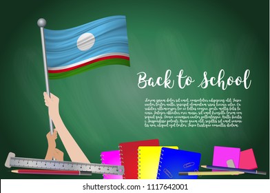 Vector flag of Sakha Republic on Black chalkboard background. Education Background with Hands Holding Up of Sakha Republic flag. Back to school with pencils, books, school items learning and childhood