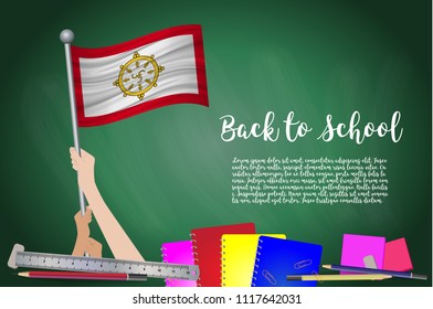 Vector flag of Sikkim on Black chalkboard background. Education Background with Hands Holding Up of Sikkim flag. Back to school with pencils, books, school items learning and childhood concept.