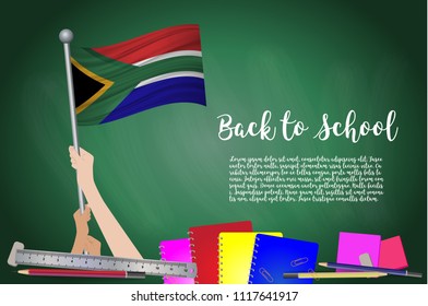 Vector flag of south african on Black chalkboard background. Education Background with Hands Holding Up of south african flag. Back to school with pencils, books, school items learning and childhood