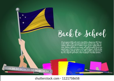 Vector flag of Tokelau on Black chalkboard background. Education Background with Hands Holding Up of Tokelau flag. Back to school with pencils, books, school items learning and childhood concept.