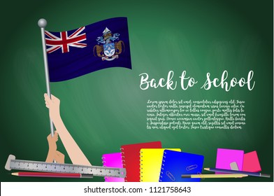 Vector flag of Tristan da Cunha on Black chalkboard background. Education Background with Hands Holding Up of Tristan da Cunha flag. Back to school with pencils, books, school items learning