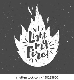 Vector flame with lettering and grunge texture. Light my fire. Burning bonfire silhouette with motivation quote and sparks. Illustration or background with space for your text.