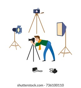 vector flat cartoon man in casual clothing wearing scarf, jeans making shoots by dslr photo camera standing on tripod and professional photo equipment set. Isolated illustration on a white background.