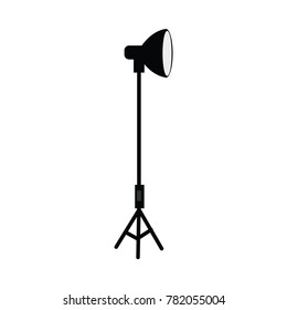 vector flat cartoon photo studio searchlight standing at special tripod stand side view. Professional photo equipment. Isolated illustration on a white background.