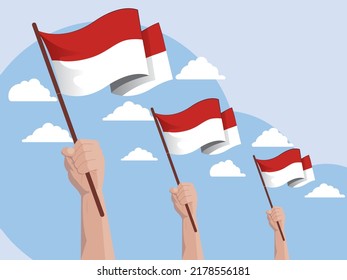 Vector flat design illustration of human hands Holding Up Indonesia Flags