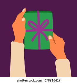 a vector flat illustration; cartoon style hands holding or giving a gift box with a ribbon; a digital hand draw; an infographic design element