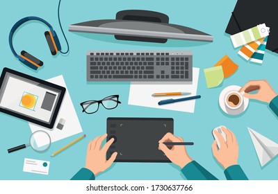 Vector flat illustration of graphic designer's desk, workplace with various equipment, top view