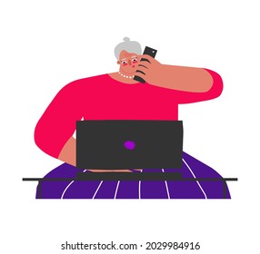 Vector flat isolated illustration. Senior Caucasian woman sits at desk and works online on laptop. Lifestyle of busy and happy freelancer. Elderly lady talks by phone. She is professional entrepreneur