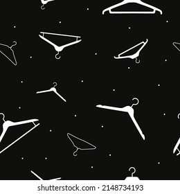 Vector flat silhouette hand drawn seamless pattern with hangers 