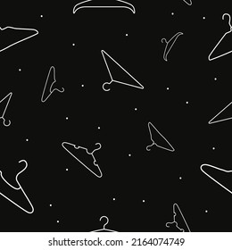 Vector flat silhouette hand drawn seamless pattern with hangers 