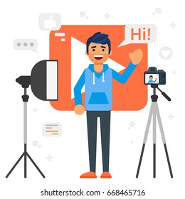 Vector flat style illustration of happy blogger man that records video blog. Vlog concept.