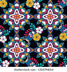 Vector floral ethnic seamless pattern in doodle style with flowers and leaves. Gentle, spring, summer floral background. Decorated with mandala elements