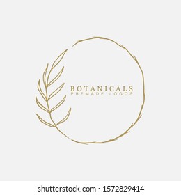 Vector floral hand drawn logo template in elegant and minimal style with gold color on grey background illustration. Circle frames logos. For badges, labels, logotypes and branding business identity.