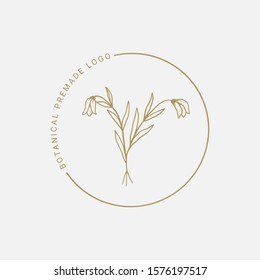 Vector floral hand drawn logo template in elegant and minimal style with gold color on grey background illustration. Circle frames logos. For badges, labels, logotypes and branding business identity.