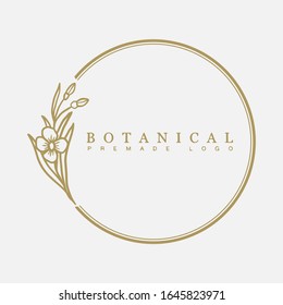 Vector floral hand drawn logo template in elegant and minimal style with gold color on grey background illustration. Circle frames logos. For badges, labels, logotypes and branding business identity.