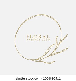 Vector floral hand drawn logo template in elegant and minimal style with gold color on grey background illustration. Circle frames logos. For badges, labels, logotypes and branding business identity.