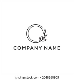 Vector floral hand drawn logo template in elegant and minimal style  on background illustration. Circle frames logos. For badges, labels, logotypes and branding business identity.