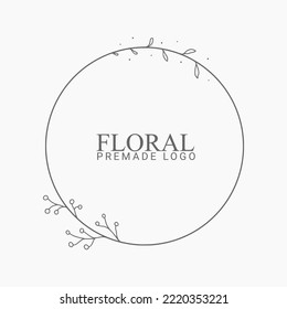 Vector floral hand drawn logo template in elegant and minimal style with black color on grey background illustration. Circle frames logos. For badges, labels, logotypes and branding business identity.