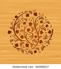 Vector floral ornament of grape vines and bunches of grapes on a wooden background