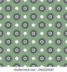 Vector floral pattern with polka dots on a green background. Seamless background.