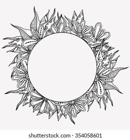 Vector floral round frame. Ethnic retro design in zentangle style with flowers and abstract elements,Black line art on white background.