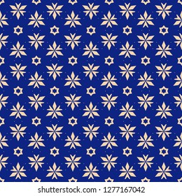 Vector floral seamless pattern. Elegant Christmas background. Dark blue and yellow geometric texture with small flowers, stars, triangles. Winter holiday ornament. Design for decoration, gift paper